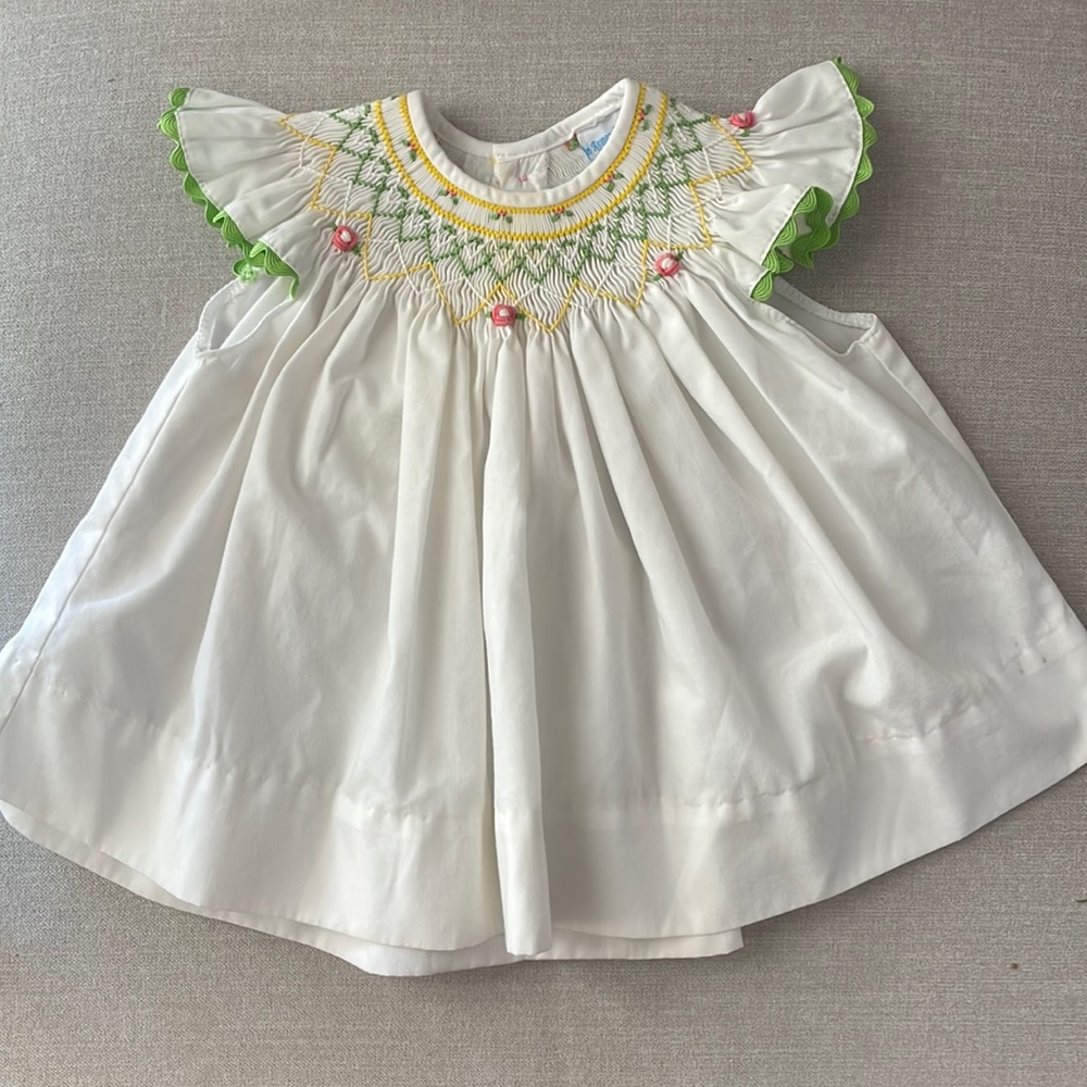 White smocked dress with green, yellow and pink
